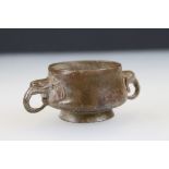 Bronze footed bowl with elephant head handles, signed with character marks to underside, approx.