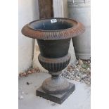 A cast iron garden urn, measures approx 48cm in height.