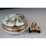 A Noritake lidded ceramic vanity jar together with a resin oriental erotic figure.