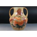 Moorcroft Large Twin Handled Vase decorated in the Fruits and Finches pattern on Ochre ground,