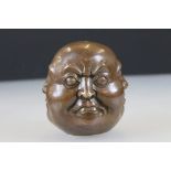 Four faced Buddha paperweight signed with character marks to underside, approx. 9cm tall