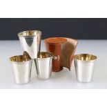 Set of Four Gilt Lined Stacking Stirrup Cups in a leather case