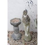 A reconstituted stone garden ornament together with a stone bird bath