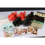 A small collection of View master slide viewers together with a quantity of slide reels.