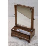 George III Walnut Swing Dressing Mirror with shaped drawer and frieze, 32cm high x 51cm high