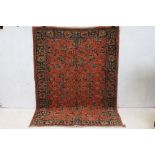 Eastern Red Ground Wool Rug with an ' Orient ' label, 168cm x 120cm