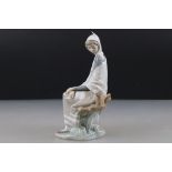 Lladro Figurine of a Girl sat on a tree stump with picnic basket and bird, 26cm high