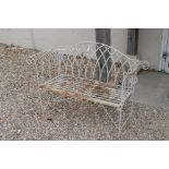A white painted wrought iron garden bench, measures approx 130cm in width.