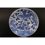 Chinese Blue and White Charger decorated with Dragon and Mythical Birds chasing a pearl amongst