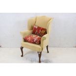 Early 20th century Queen Anne Revival Armchair with yellow fabric upholstery, raised on Lappet front