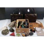 A collection of vintage handbags, purses and fans.