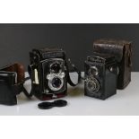 A Yashica-Mat Copal MXV twin lens reflex camera together with a Vitaflex twin lens reflex camera.