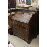 18th century Oak Bureau, the moulded sloping front opening to a fitted interior with well, over