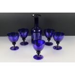 Bristol Blue style Glass Carafe, 25cm high together with five matching Wine Glasses
