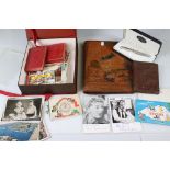 A group of mixed collectables to include a coin stamp cover, mixed ephemera to include postcards and