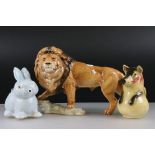 Goebel Lion stood on a rocky outcrop, model 36 019 25, 47cm long together with a Novelty ' Bunny '