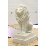 A large white composite ornamental lion, measures approx 72cm in height.