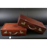 Two vintage leather suitcases