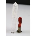 An antique wax seal with red crystal handle together with a polished clear crystal.