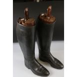 Pair of leather riding boots with trees