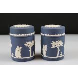 Pair of Wedgwood cobalt blue jasperware lidded containers with classical Roman or Greek figures in