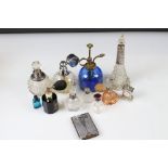 A small collection of scent bottles to include hallmarked silver collared examples together with a