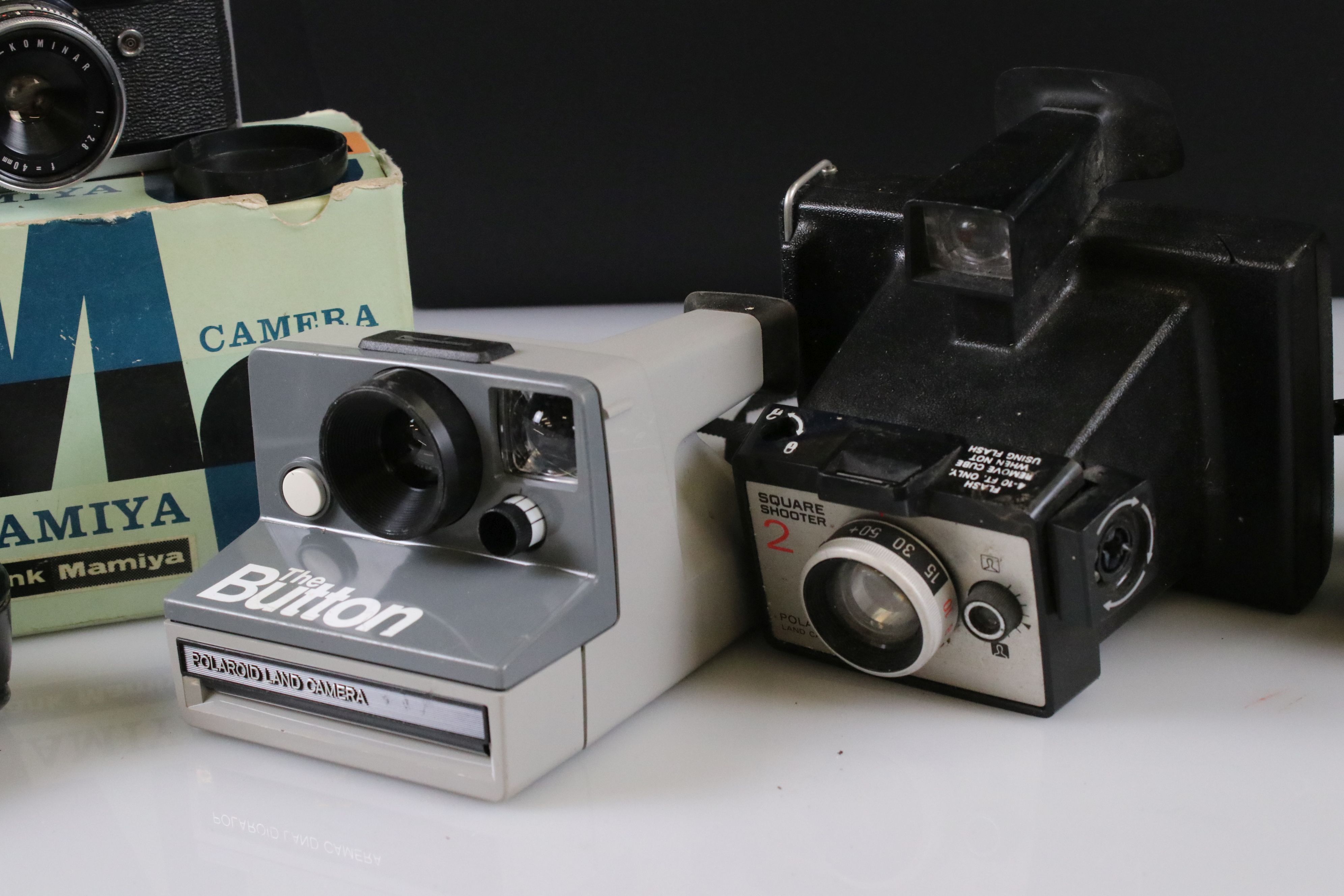 A small collection of vintage cameras to include Polaroid and Bell & Howell examples. - Image 2 of 4