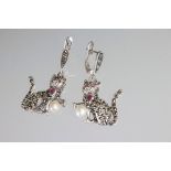 Pair of silver and marcasite drop earrings in the form of cats with ruby eyes