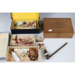 A small group of collectables to include an antique wooden pipe, a group of three wooden jigsaws and