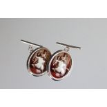 Pair of silver cufflinks with enamel panels depicting a nude female