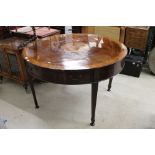 19th century mahogany centre table, the sectioned top with a satinwood central roundel with pen work