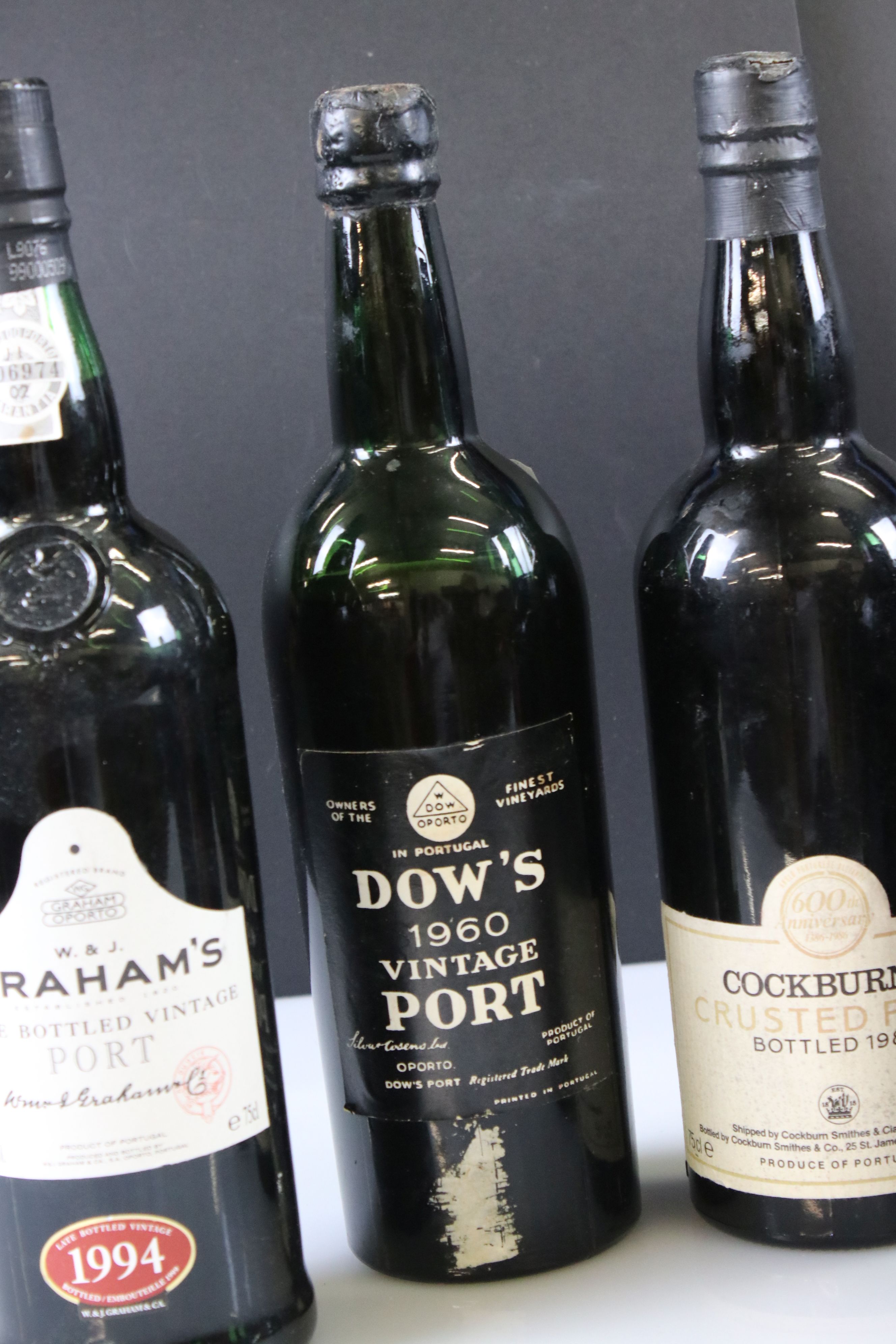 A collection of four bottles of Port to include Dow's and Cockburns together with a bottle of 1976 - Image 8 of 10