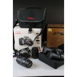 A Canon Eos 3000 35mm SLR camera complete with lenses and accessories.