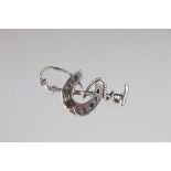 Silver horseshoe and whip brooch