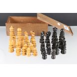 An early 20th century carved boxwood and ebony chess set.