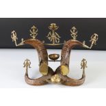 Horn and brass ornament with figures, possibly a Buddhist altarpiece