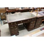 Victorian Burr Walnut Twin Pedestal Desk with brown leather inset top and an arrangement of nine