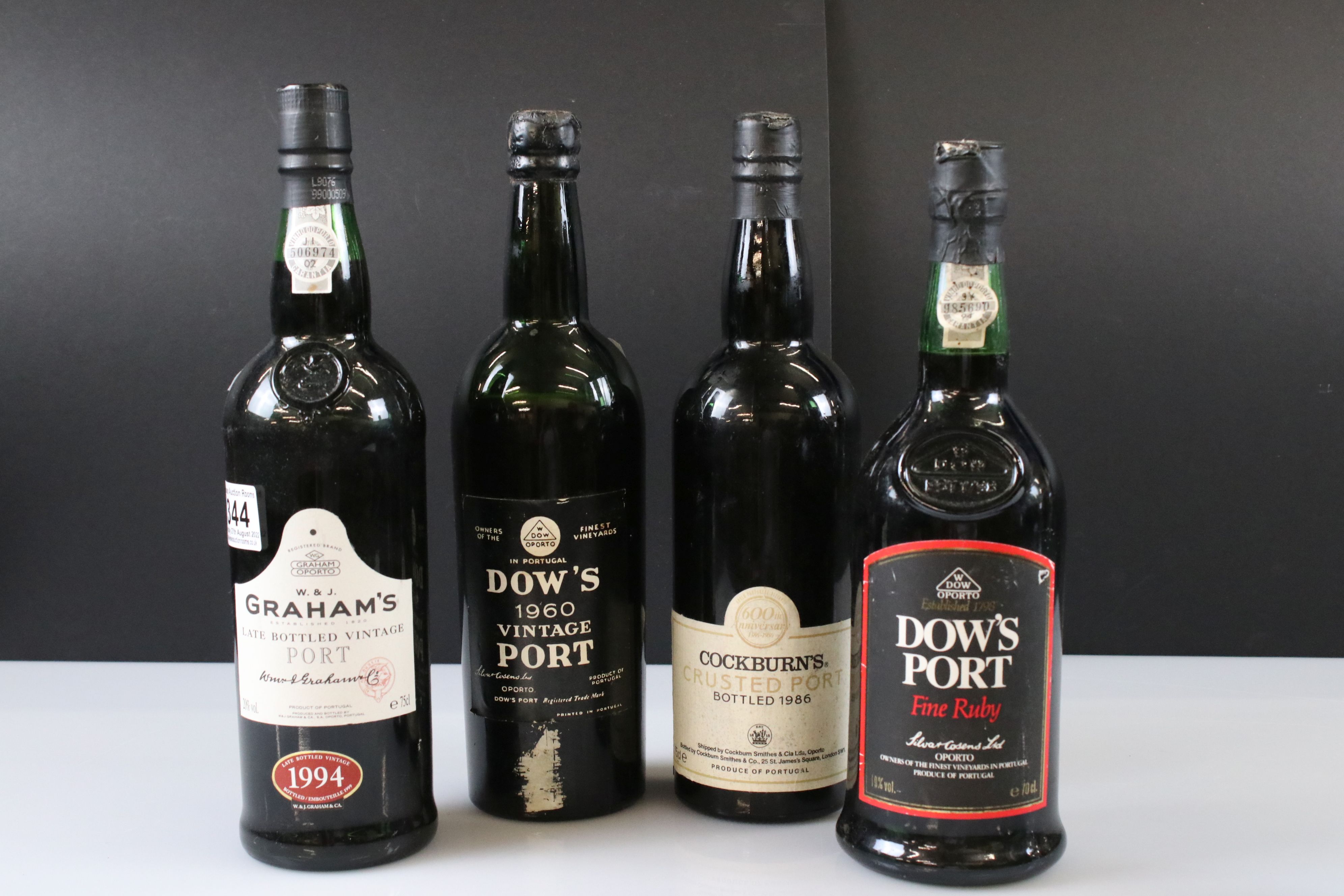 A collection of four bottles of Port to include Dow's and Cockburns together with a bottle of 1976 - Image 6 of 10