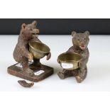 Two antique Black Forest carved wooden Bear ashtray's with brass bowls.