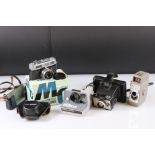 A small collection of vintage cameras to include Polaroid and Bell & Howell examples.