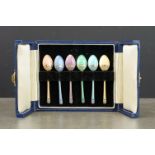 Six harlequin enamelled silver demitasse spoons, the bowl reverse and terminal with silver inlaid