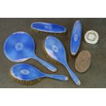 Five piece enamelled silver dressing table brush set (enamel damaged), a silver backed oval