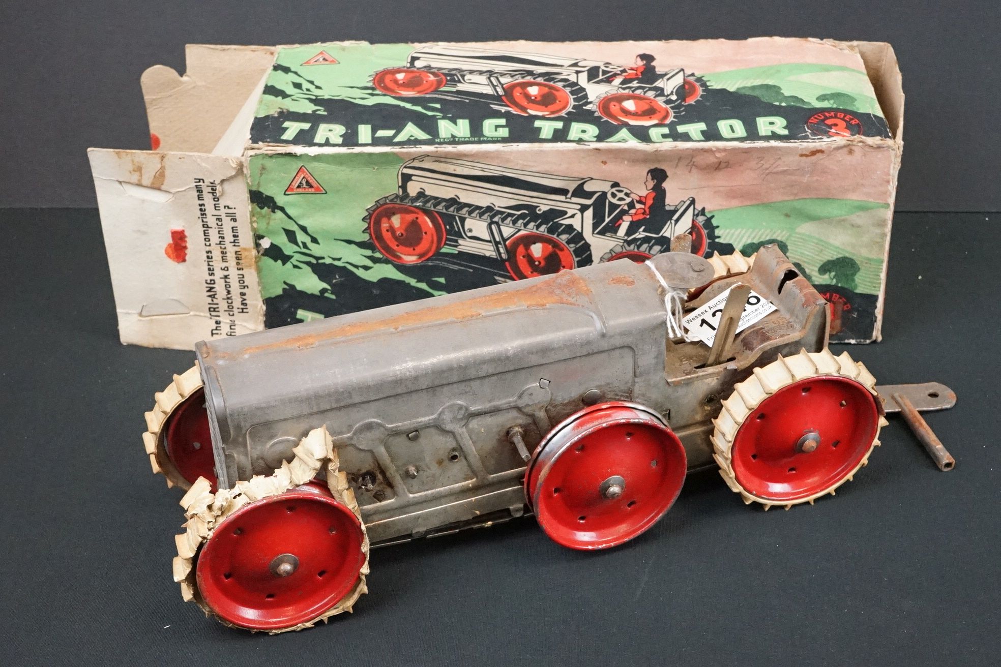 Boxed Triang Tractor Number 3 tinplate clockwork model in silver with red wheels, cream treads