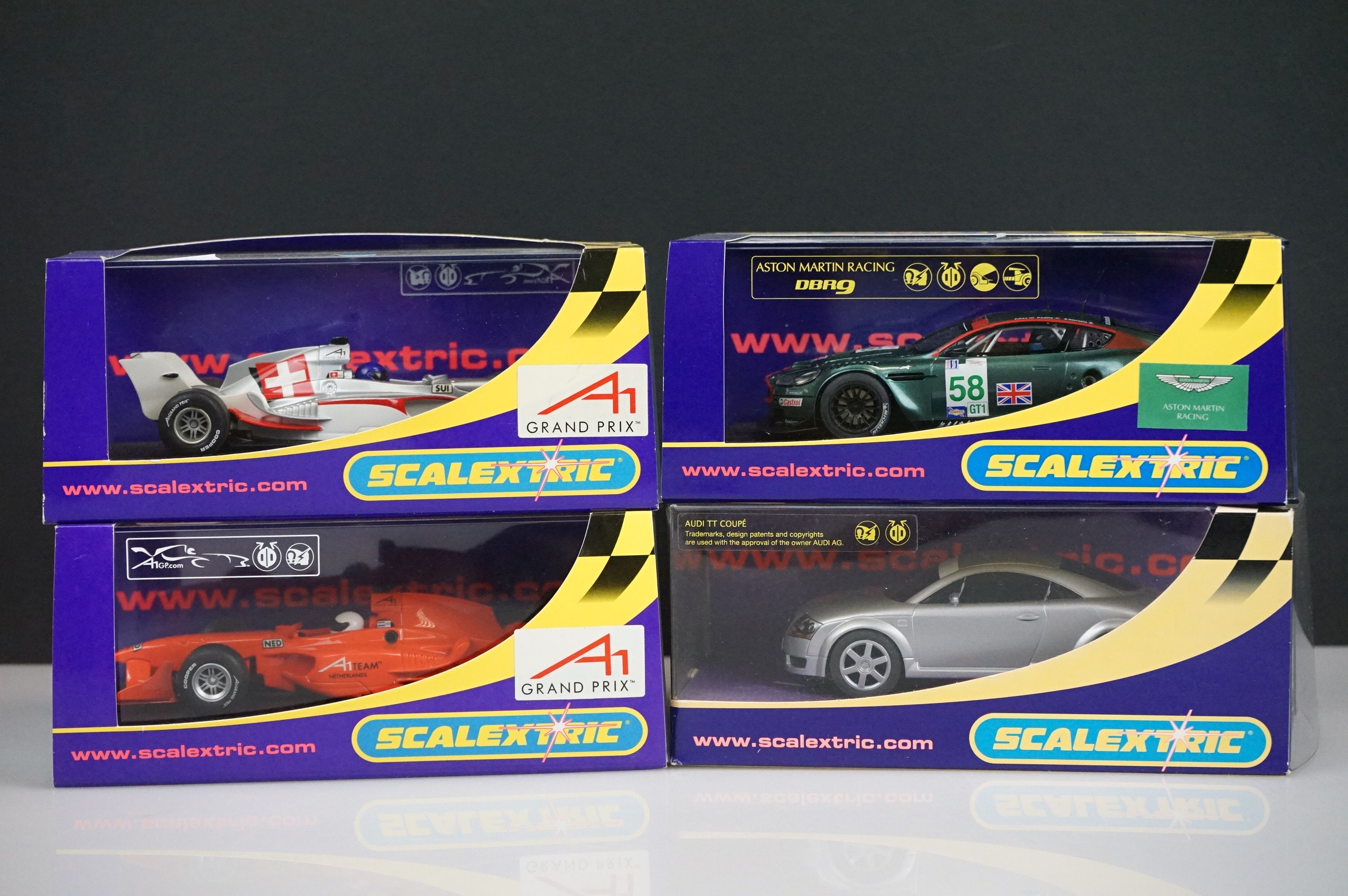 Four cased / boxed Scalextric slot cars to include C2708 A1 Grand Prix Team Netherlands, C2709 A1