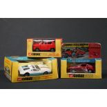 Three boxed Corgi diecast models to include 341 Mini Marcos GT 850 in metallic red, Whizzwheels