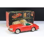 Original boxed Schuco 5503 Elektro Phanomenal tin plate car in red complete with 6 x wooden pegs,