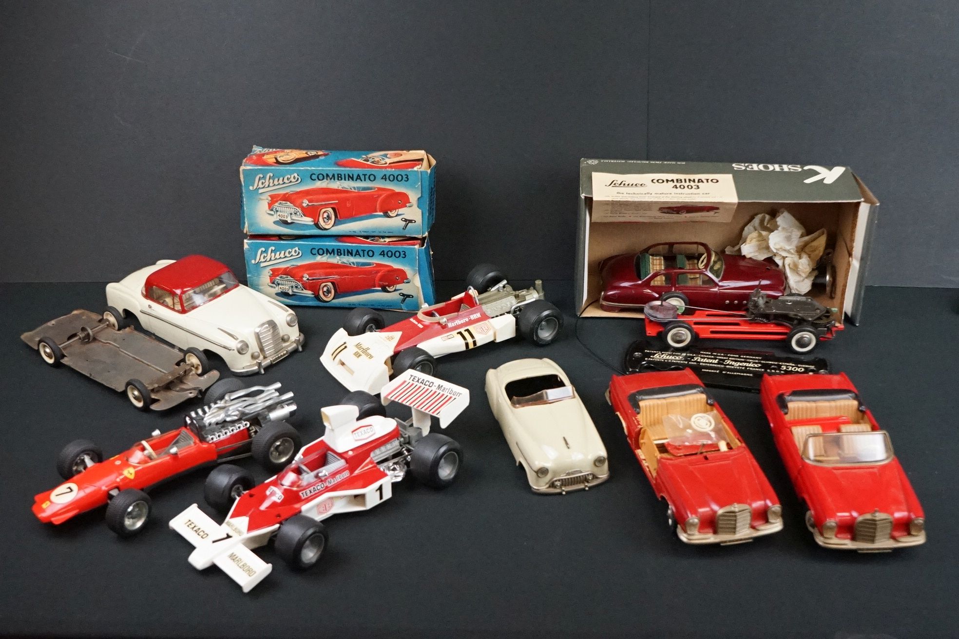 Group of play worn or 'in-parts' Schuco tinplate and plastic models to include Rollfix 1085,