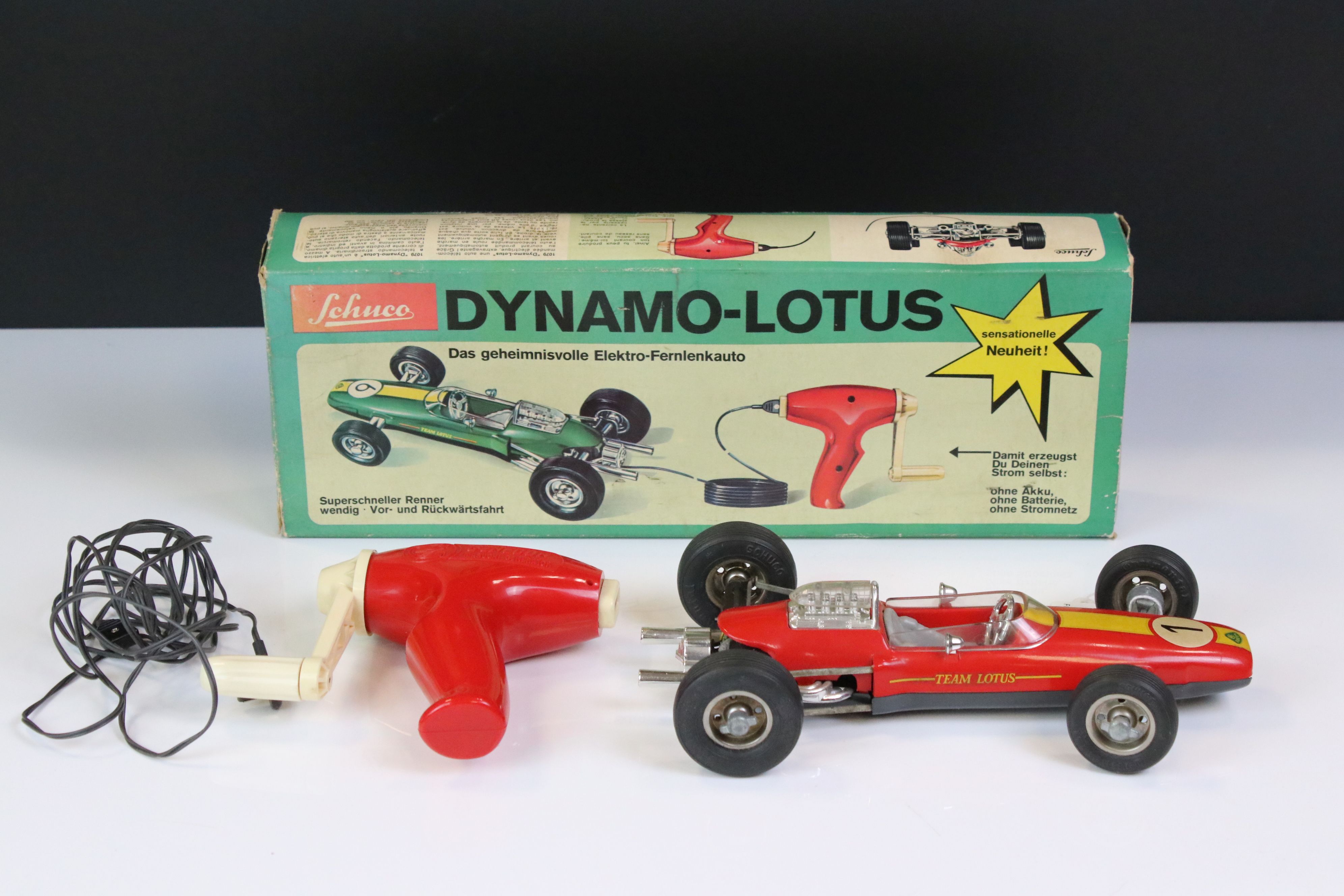 Boxed Schuco 1079 Dynamo Lotus tin plate F1 racing car with remote controller, in red, race number