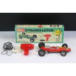 Boxed Schuco 1079 Dynamo Lotus tin plate F1 racing car with remote controller, in red, race number