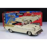 Boxed Schuco Synchromatic 5700 tin plate Packard model with white body and beige fins, red interior,